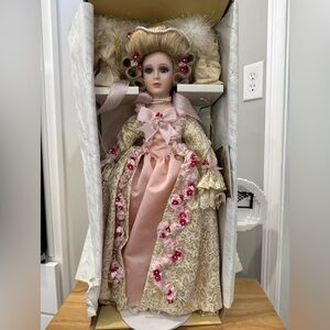 Elegant Porcelain Doll with Pink and Cream Dress